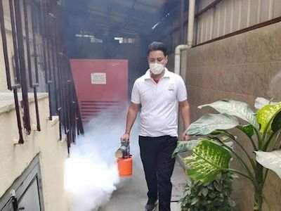 Technician fogging a commercial service lane for mosquitoes