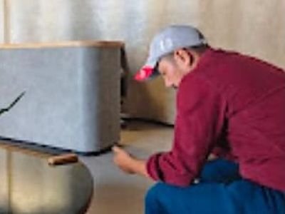 Technician treating the reception area of an office in Indirapuram